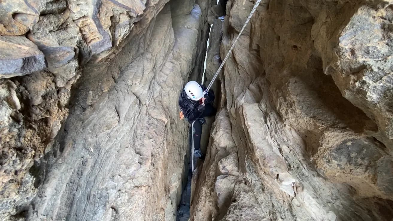Descending between the narrow rock walls